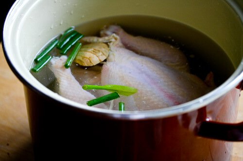 Hainanese Chicken Rice Recipe - Put chicken in big pot and fill with water