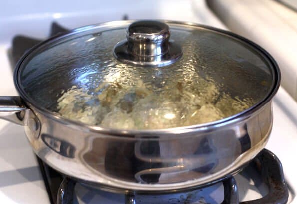 Gyoza Recipe - Add water into pan and seal