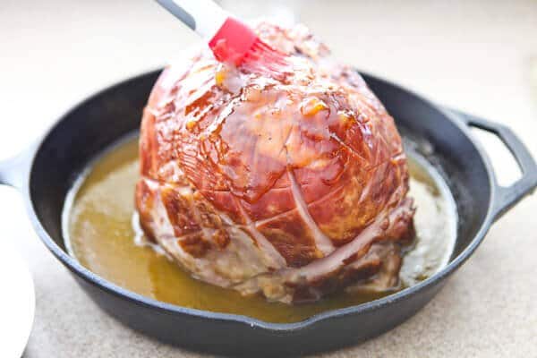 brushing ham with glaze