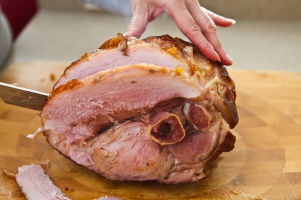 cutting a slice of pork 