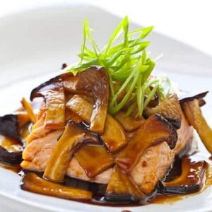 Grilled salmon topped with teriyaki mushrooms