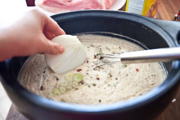 placing onion in pot