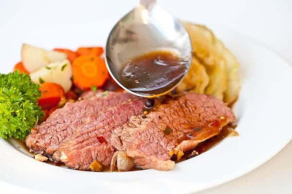 sauce going onto guinness corned beef