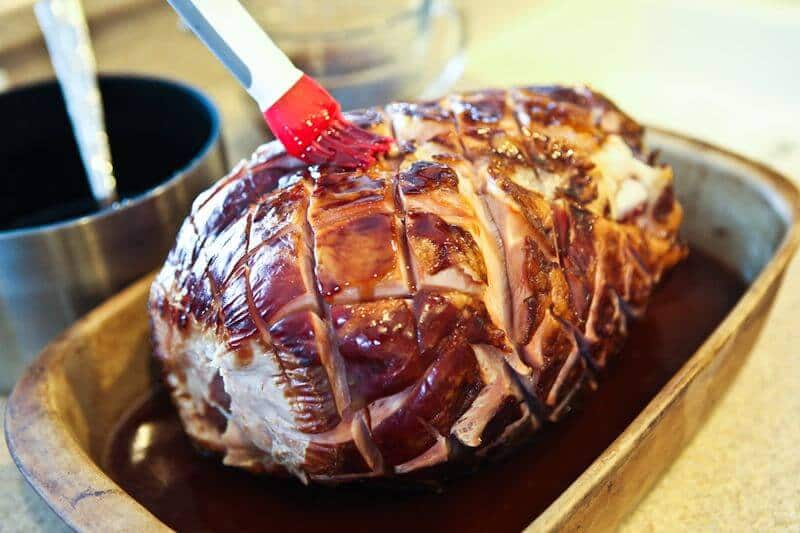 glazed ham recipe prep brushing glaze on ham 