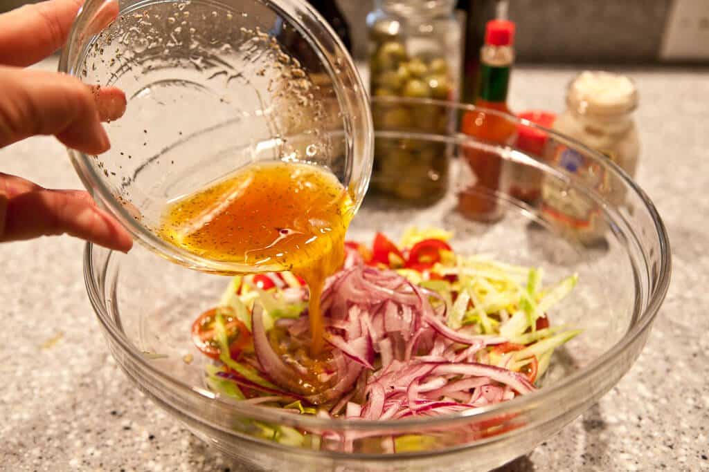 Flank Steak with Bloody Mary Tomato Salad Recipe - Pour dressing over salad