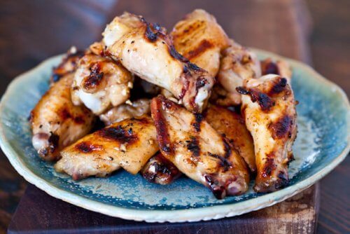 grilled wings on a blue plate