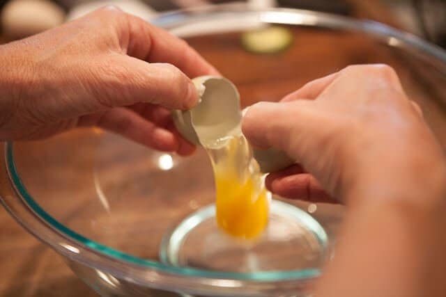 cracking egg Zucchini Frittata Recipe