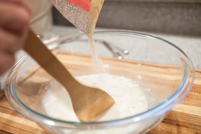 Pork Belly Buns Recipe pouring flour