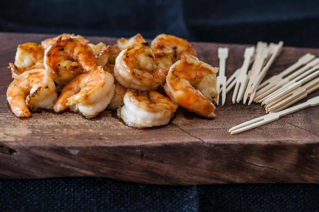 shrimp on wood plank