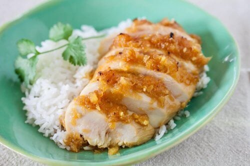 Pineapple chicken teriyaki served with rice on a blue plate