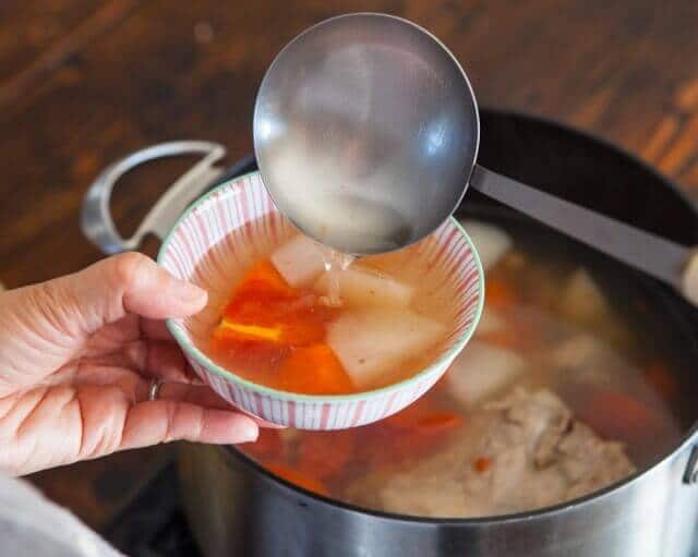 pouring Chinese Daikon and Carrot Soup Recipe