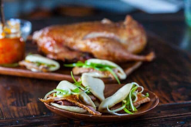 a plate of roasted Duck recipe and Chinese Steamed Buns