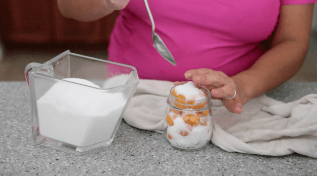 pouring slat into mason jar