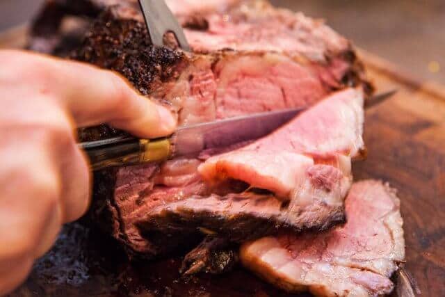 close up of cutting Prime Rib Roast 