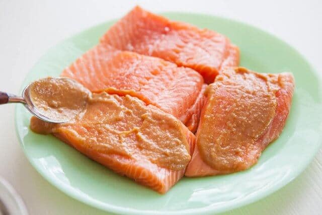 spreading miso on salmon