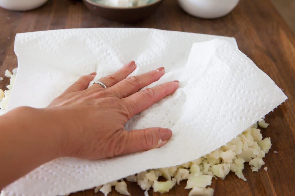 blotting cauliflower dry to make rice