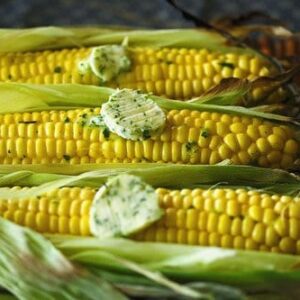 Grilled corn topped with butter