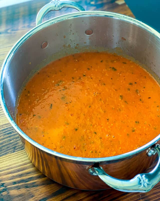 simmer the roasted tomatoes to thicken sauce, if you wish