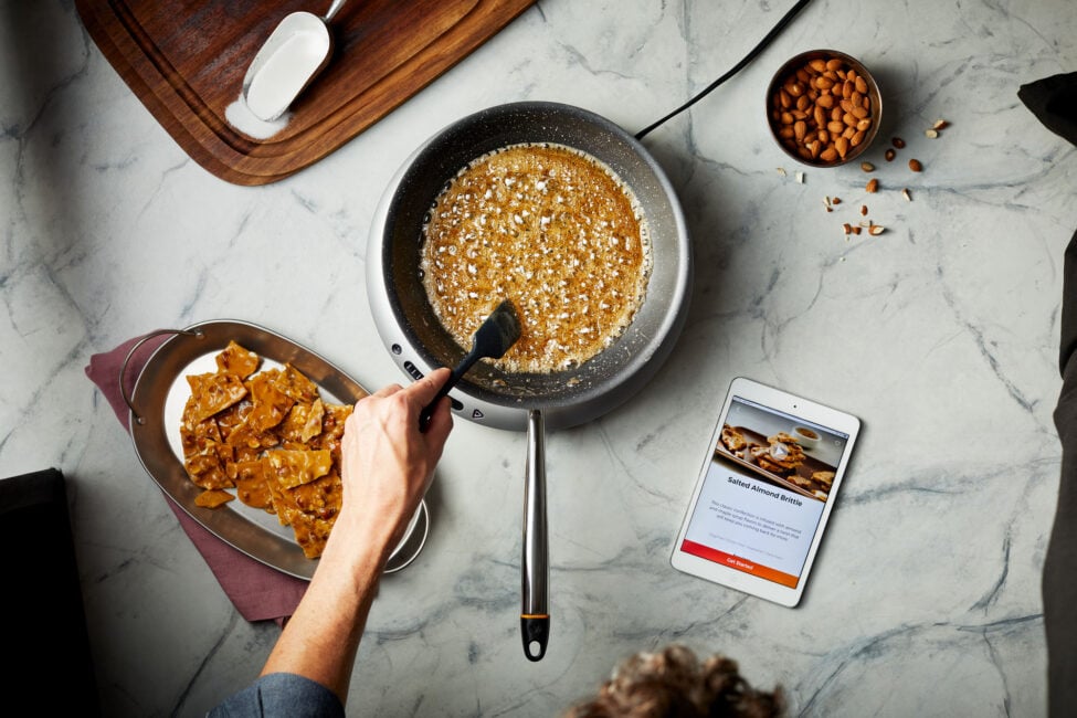 The Hestan Cue cookware and induction cooktop are connected to the app