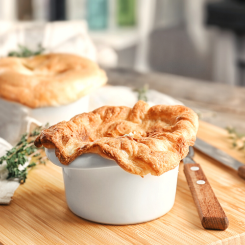 Chicken pot pie in a white ramekin.