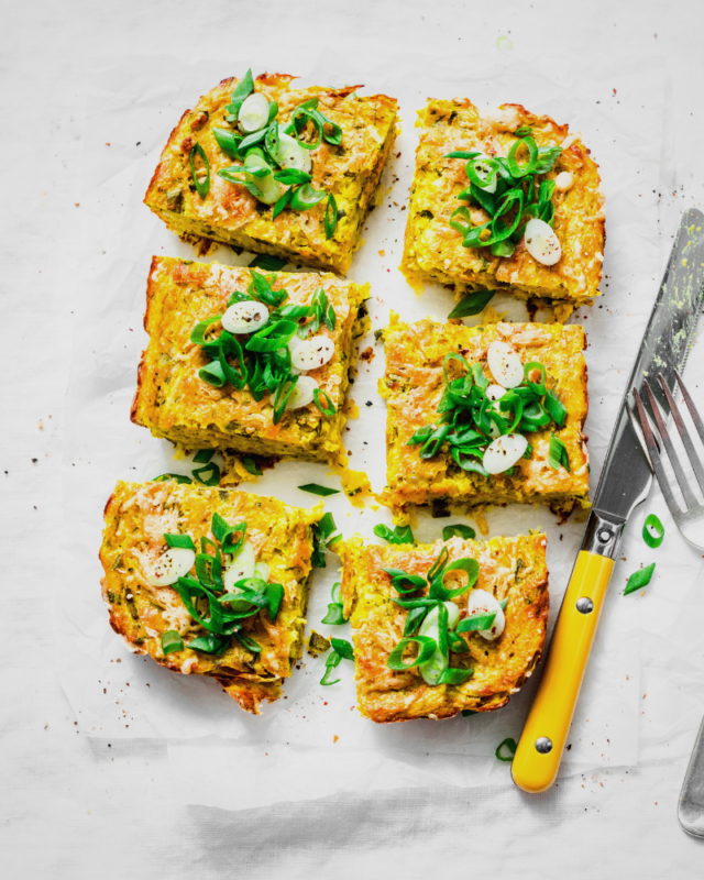 six flices of frittata with herbs on top.