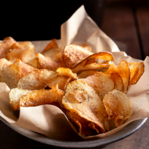 Big bowl of homemade potato chips.