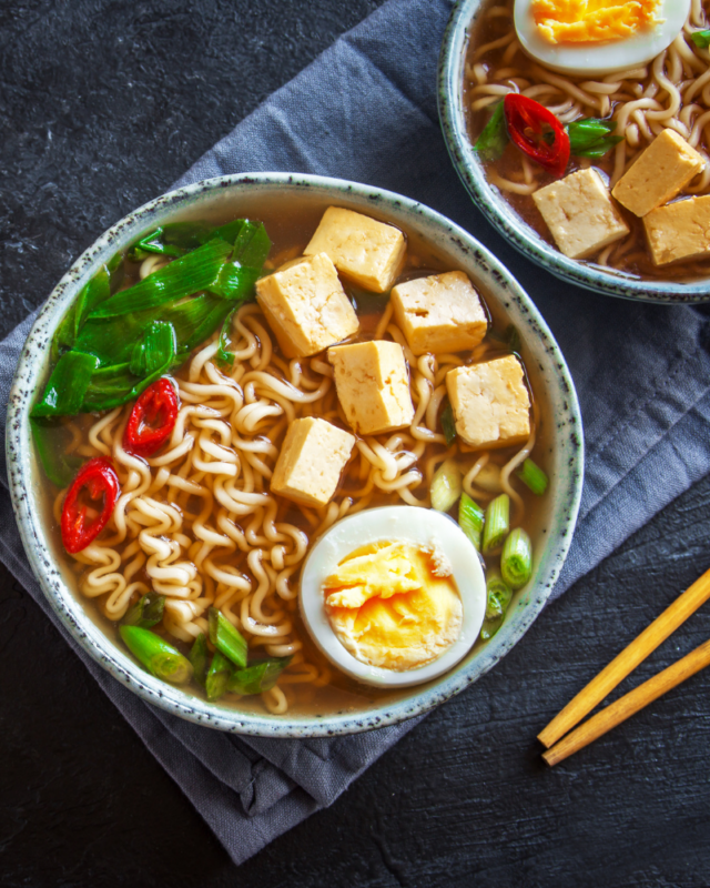 two bowls of ramen noodle soup. 