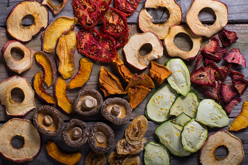 An assortment of organic dried fruits and vegetables prepared for cooking.