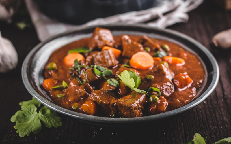 bowl of steak carrots meat potatoes