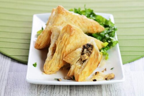 A plate of meat-filled puff pastries