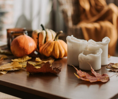 Embrace the breathtaking palette of fall by collecting and utilizing vibrant leaves to adorn your tablescape.