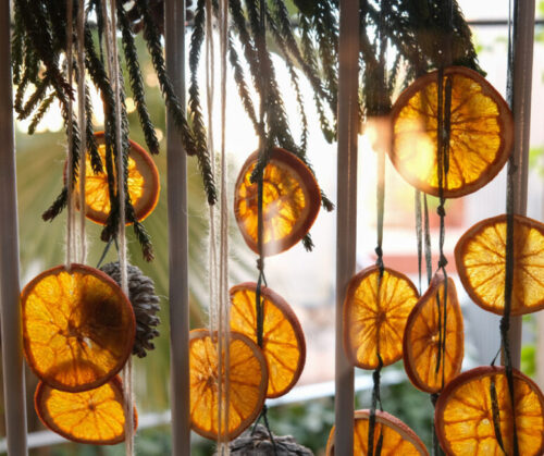 Dehydrated orange slices strung into a garland bring a burst of color and a whisper of sweet citrus scent to your autumn décor.