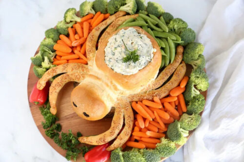 This cute and creepy spider bread dipping bowl is the creation of It's Always Autumn.