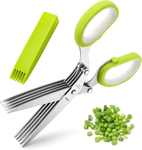 Stainless steel 5-blade herb scissors with vibrant green handles, accompanied by a matching green cleaning comb. Chopped green herbs are showcased nearby, demonstrating the scissors' precision.