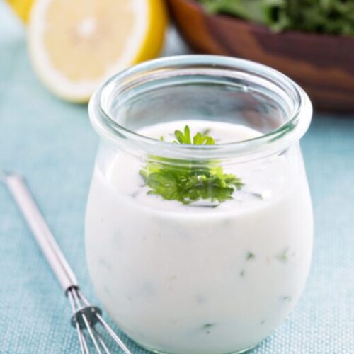 Tarragon Yogurt Dressing in glass jar with whisk