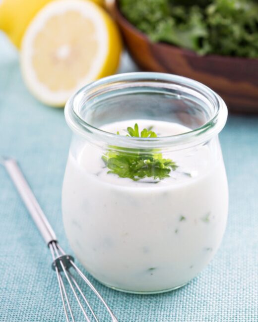 Tarragon Yogurt Dressing in glass jar with whisk