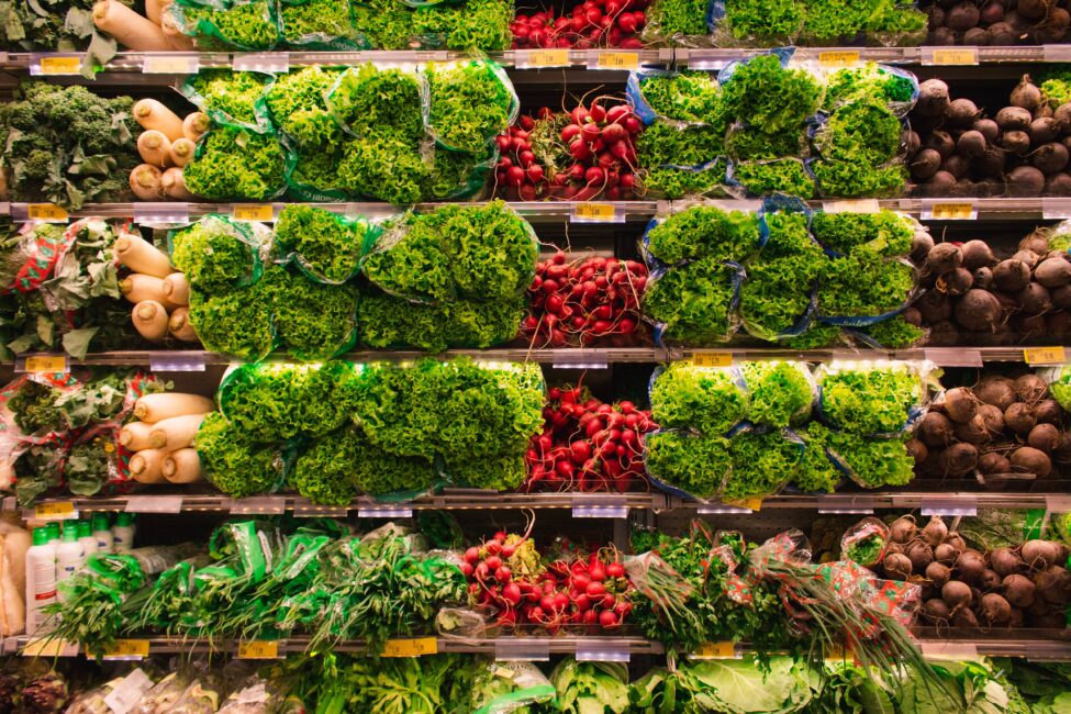 Grocery Store produce aisle with lettuce and other vegetables