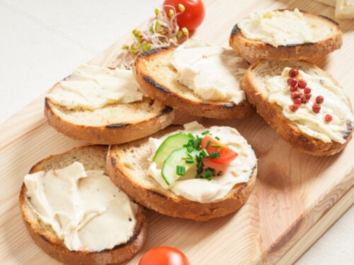 Appetizer of cream cheese and garnish on small pieces of toast