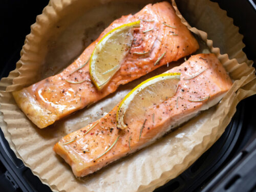 Salmon with lemon on parchment liner in air fryer