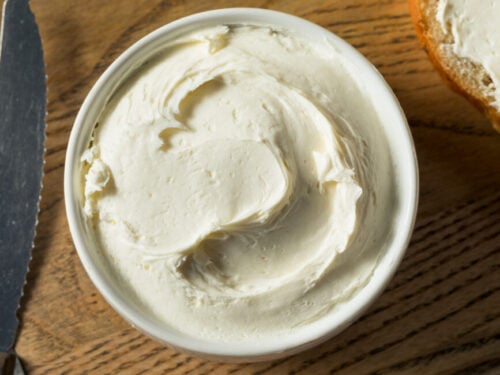 A plastic container of cream cheese