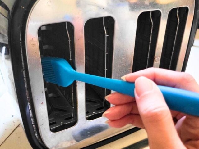 Brushing crumbs from the toaster