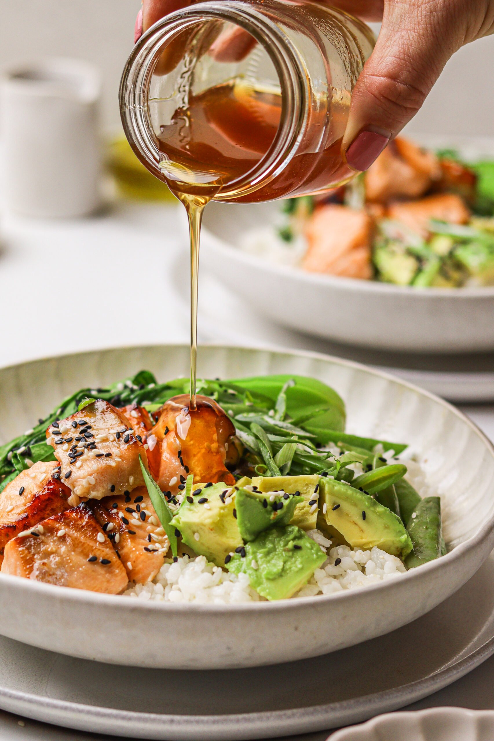 Hot Honey Salmon Bowl with honey drizzle