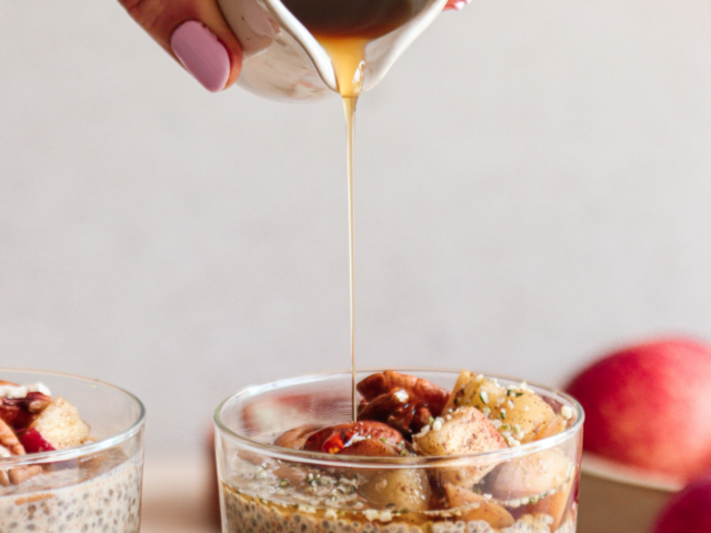 pouring honey on chia seed pudding